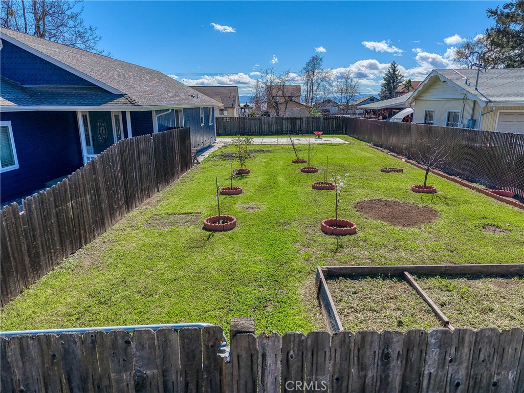 3483 Beach Street Nice, CA 95464 - Photo 33 of 40 a view of a wooden deck and a yard