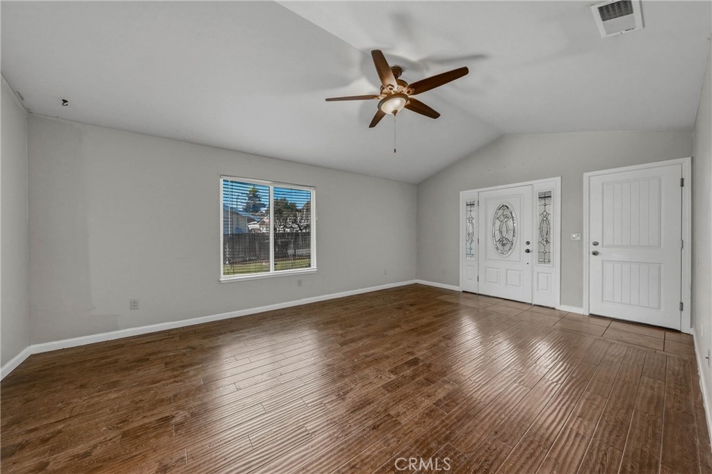3483 Beach Street Nice, CA 95464 - Photo 5 of 40 a view of an empty room with wooden floor and a window
