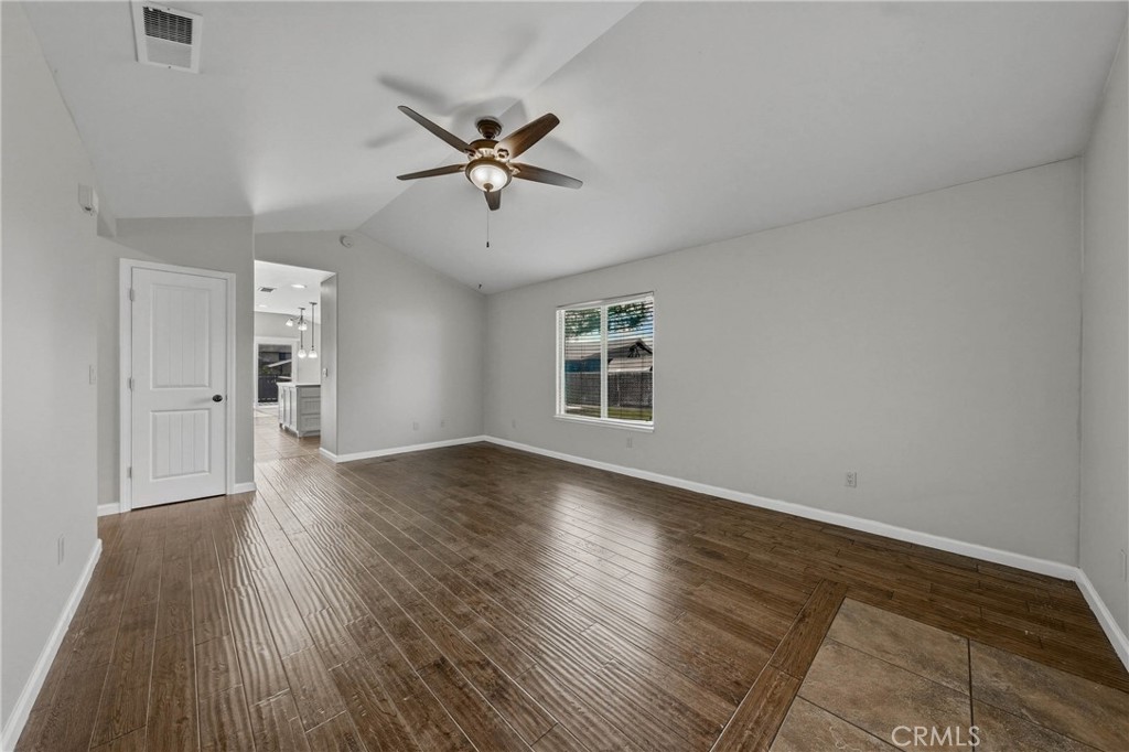 3483 Beach Street Nice, CA 95464 - Photo 6 of 40 a view of empty room with wooden floor and fan