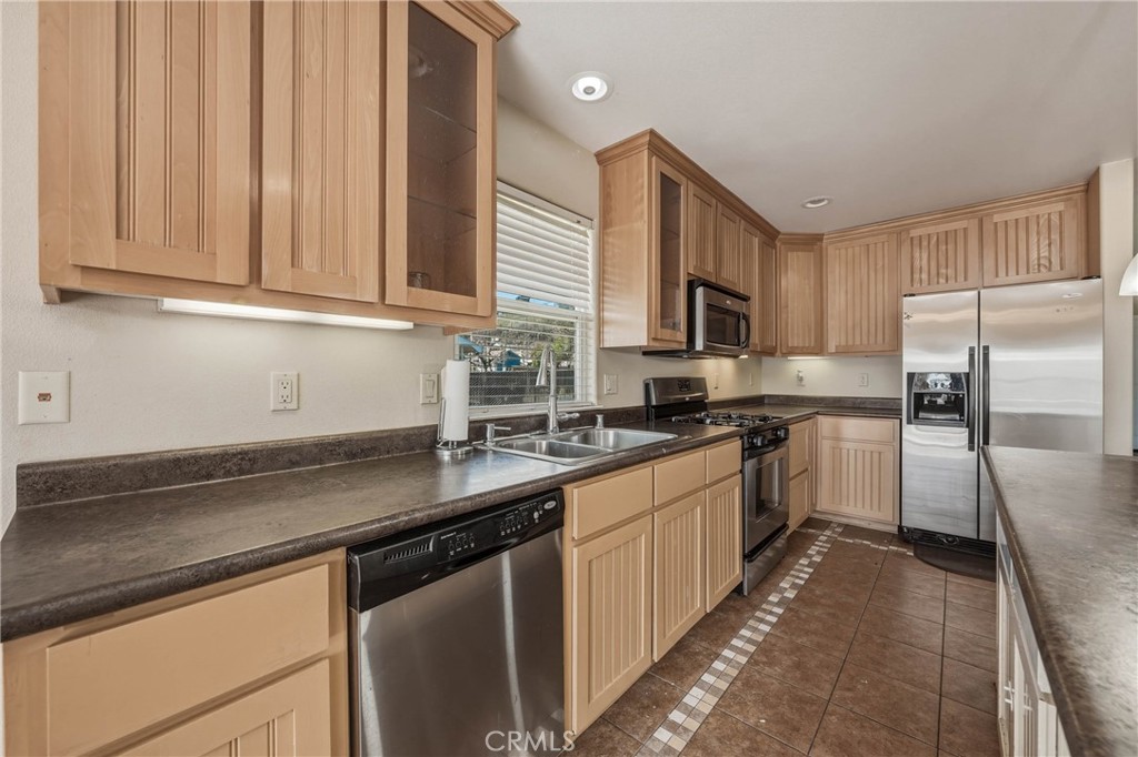 3483 Beach Street Nice, CA 95464 - Photo 9 of 40 a kitchen with kitchen island granite countertop a sink stainless steel appliances and cabinets