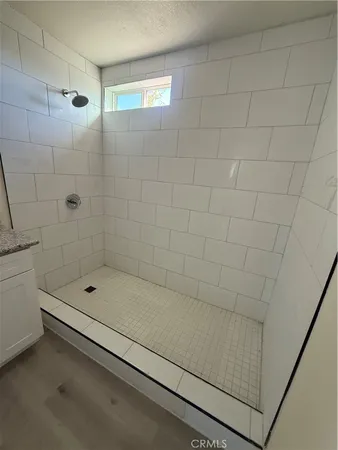 a bathroom with a shower and a bathtub