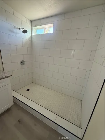 a bathroom with a shower and a bathtub