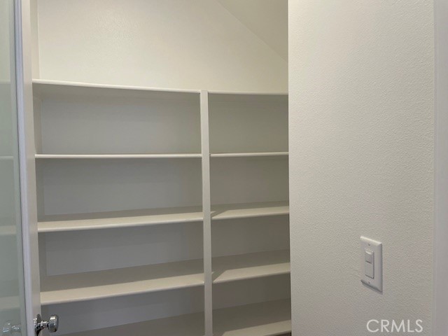 213 Shoveler Irvine, CA 92618 - Photo 5 of 19 a view of walk in closet with empty racks