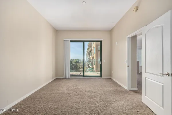 a view of an empty room with a window