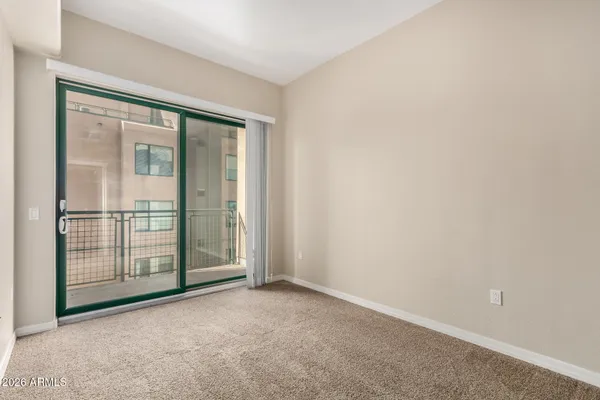 an empty room with sliding door