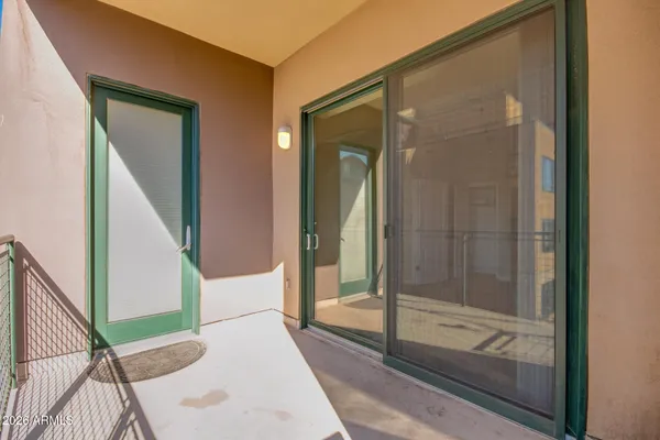a view of a balcony and a street