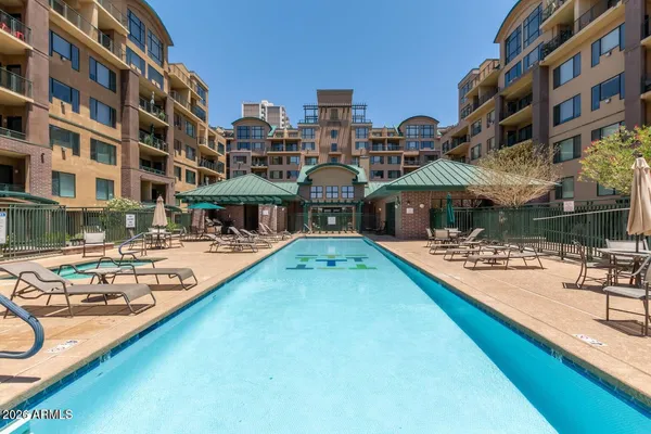 a view of a swimming pool with a lounge chairs