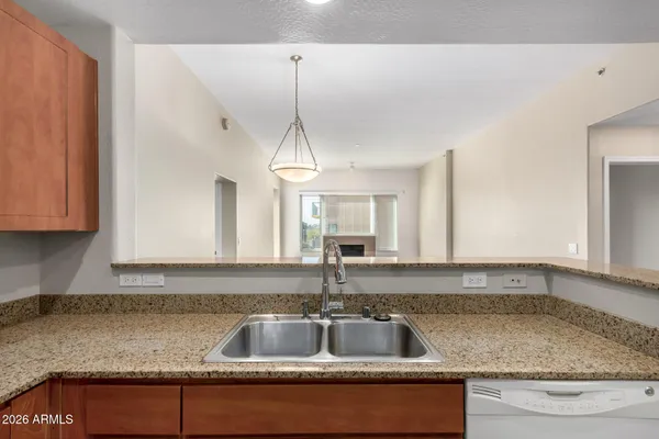 a kitchen with granite countertop a sink and a granite counter tops