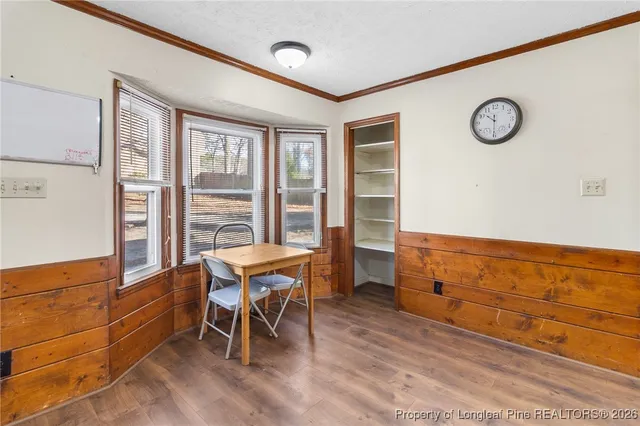 a view of a room with furniture and windows