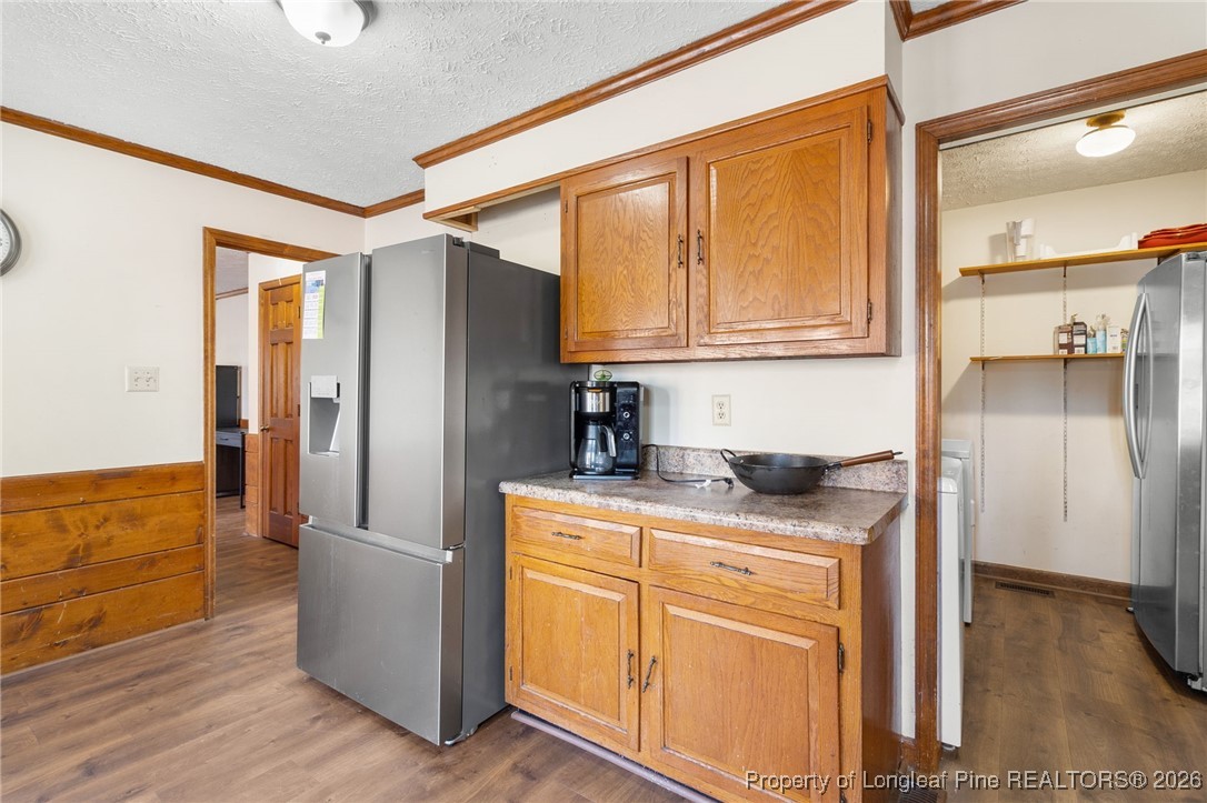 2924 Walden Road Fayetteville, NC 28303 - Photo 15 of 44 a kitchen with stainless steel appliances granite countertop a refrigerator and a stove