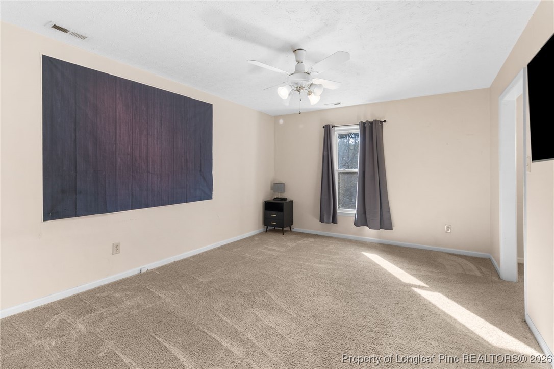 2924 Walden Road Fayetteville, NC 28303 - Photo 27 of 44 a view of an empty room with chandelier fan