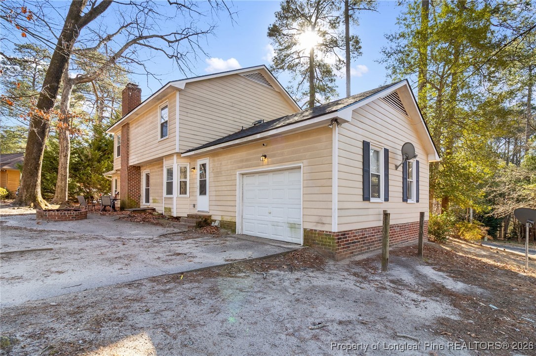 2924 Walden Road Fayetteville, NC 28303 - Photo 39 of 44 a view of a house with a backyard and trees
