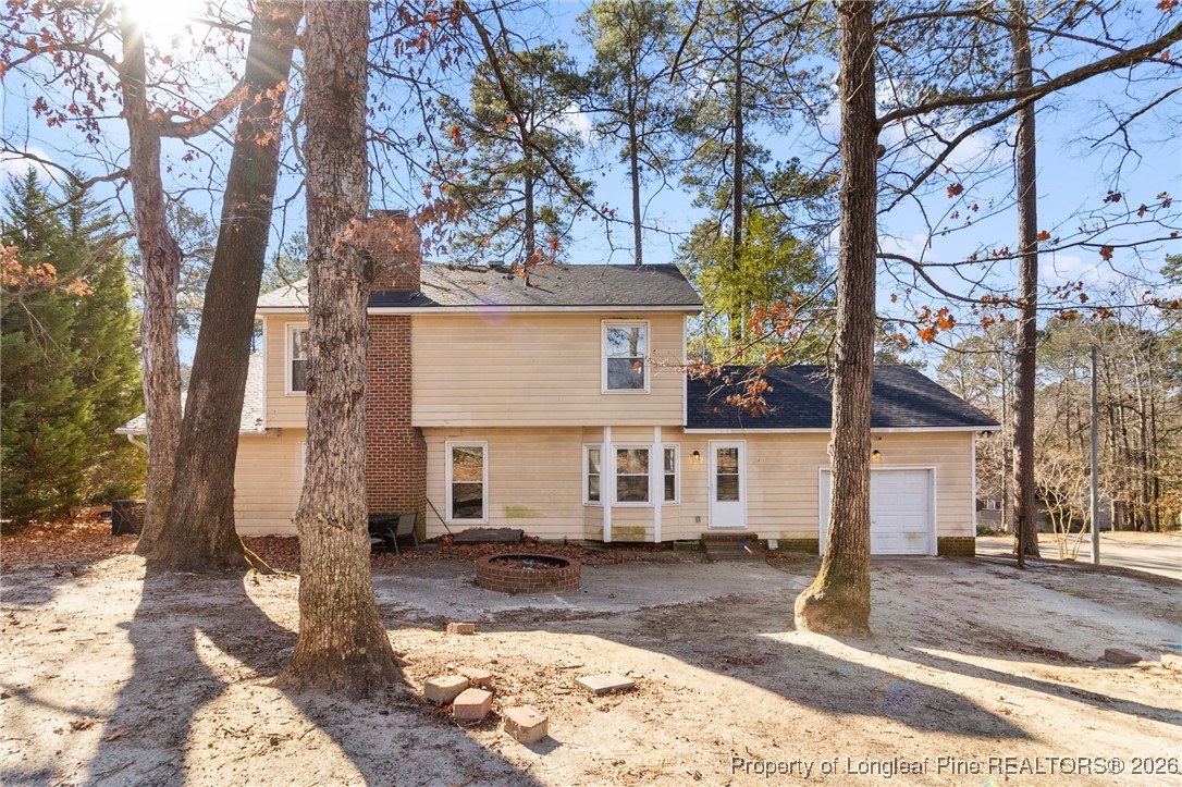 2924 Walden Road Fayetteville, NC 28303 - Photo 41 of 44 a view of a white house with a large tree