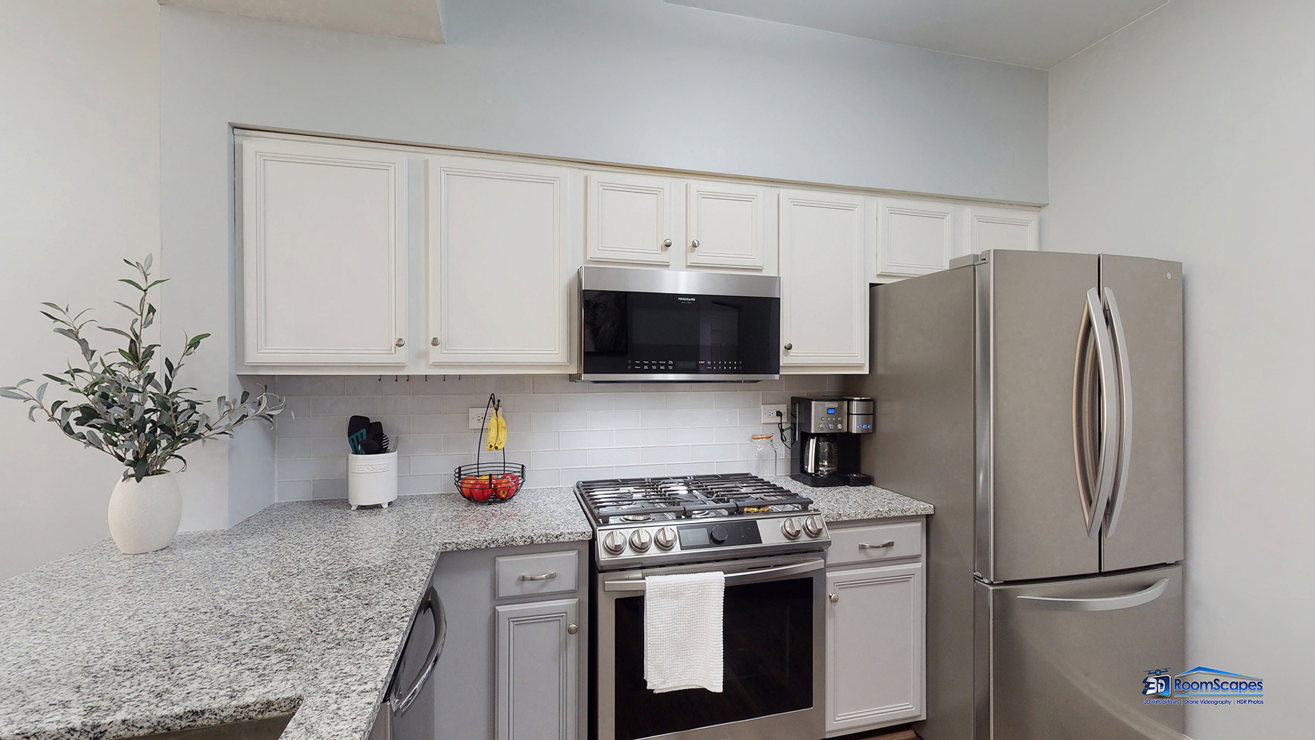 17833 Braewick Road Gurnee, IL 60031 - Photo 7 of 33 a kitchen with stainless steel appliances a refrigerator a stove a microwave and cabinets