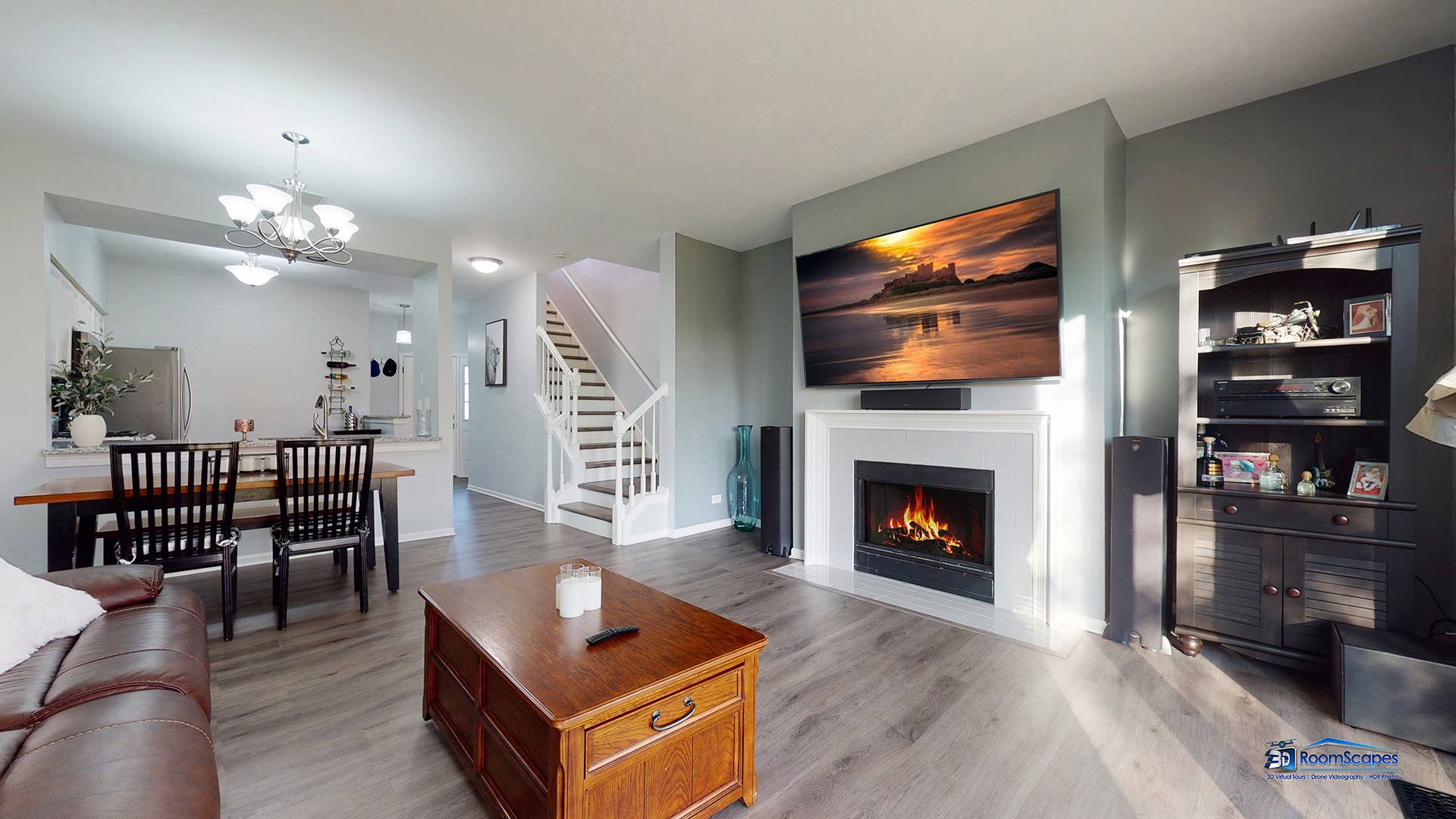 17833 Braewick Road Gurnee, IL 60031 - Photo 10 of 33 a living room with furniture a fireplace and a flat screen tv