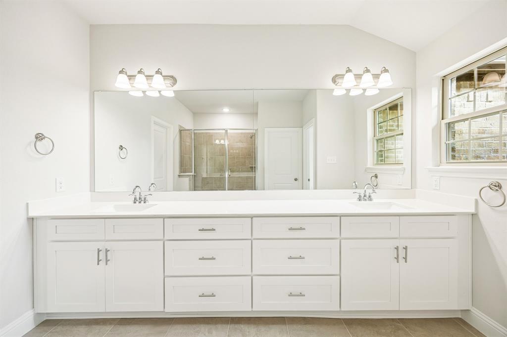 912 Heart Reef Road Plano, TX 75075 - Photo 11 of 20 a bathroom with a sink vanity and mirror