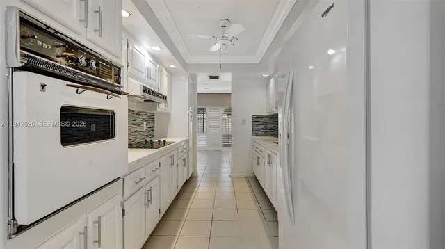 a bathroom with a sink a toilet a mirror and shower