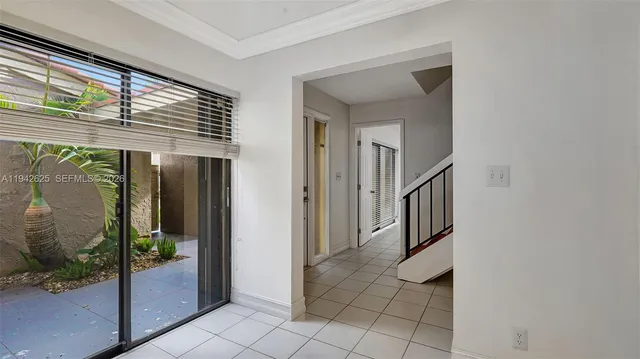 a kitchen with white cabinets