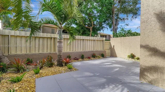 a view of staircase with railing and white walls