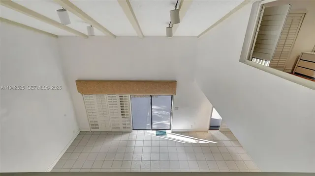 a view of a room with an empty space