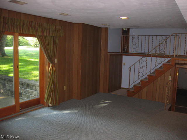 3288 Oser Road Norton, OH 44203 - Photo 6 of 25 Lower level family room is just waiting for your personal touch. Sliding doors open to the patio and offer a great view of the rear yard.