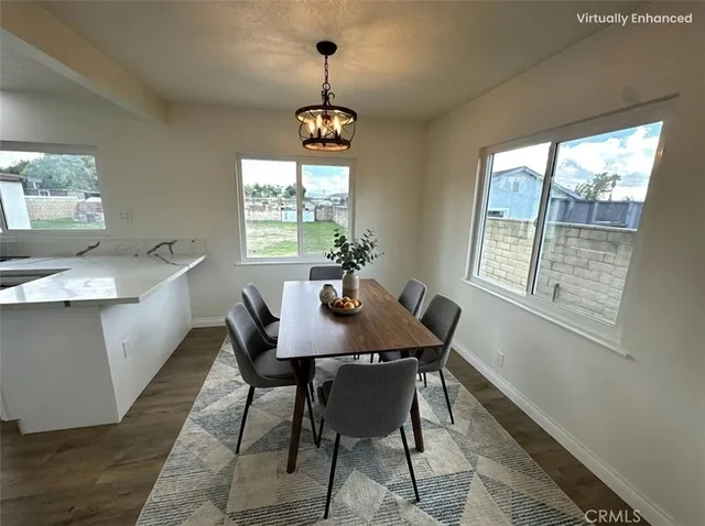 a view of a dining room with furniture window and outside view