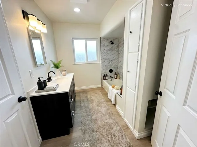 a en suite bathroom with a sink and mirror