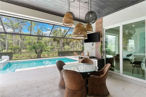 a view of a swimming pool with a patio