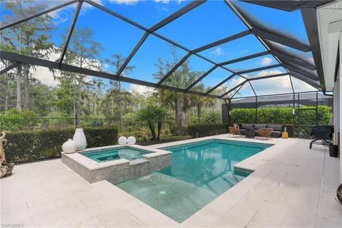 a view of swimming pool with outdoor seating