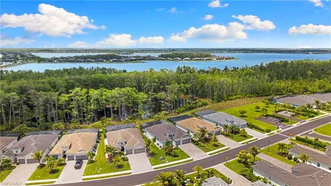 an aerial view of a house with a ocean view