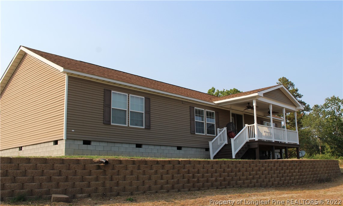 4023 Hoffman Road Jackson Springs, NC 27281 - Photo 1 of 22 a view of a house with a street