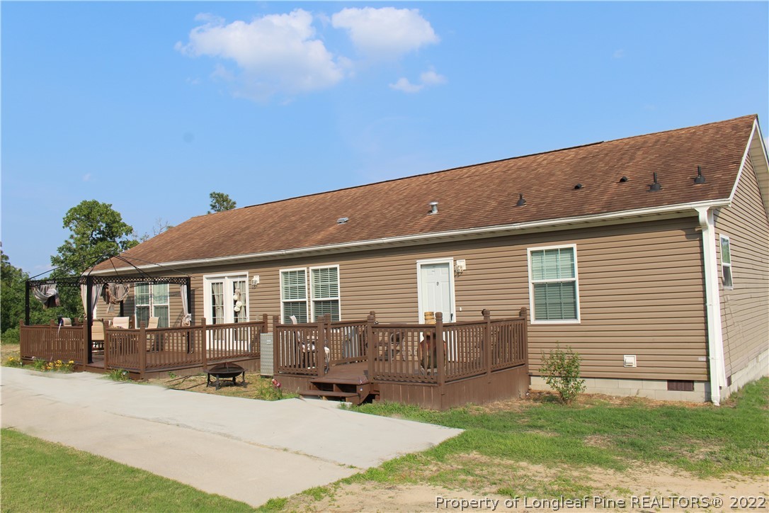4023 Hoffman Road Jackson Springs, NC 27281 - Photo 2 of 22 a backyard of a house with seating space