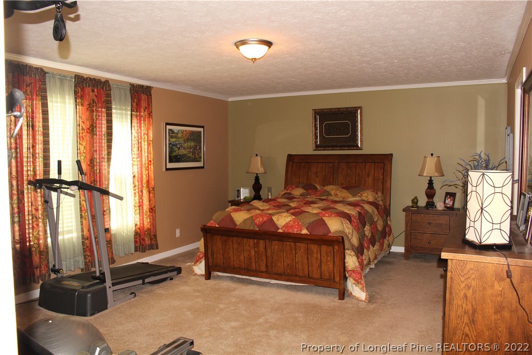 4023 Hoffman Road Jackson Springs, NC 27281 - Photo 9 of 22 a bedroom with a bed and window