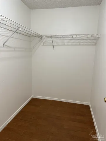 a view of a room with racks on the wall