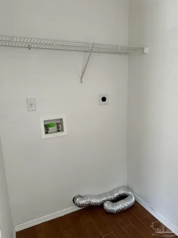 a view of a room with racks on the wall