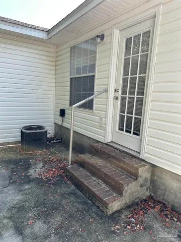 a view of house with backyard