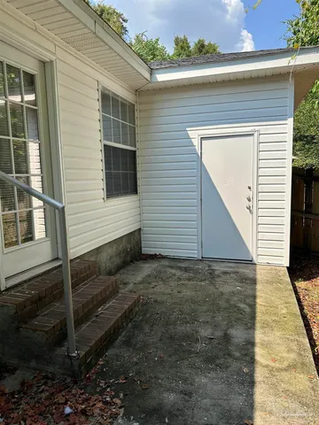 a view of house with wooden stairs