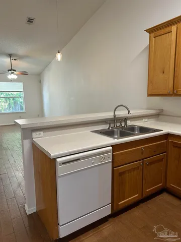 a utility room with sink dryer and washer