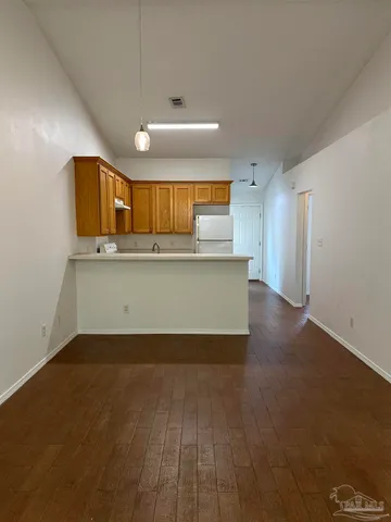 a view of kitchen with wooden floor