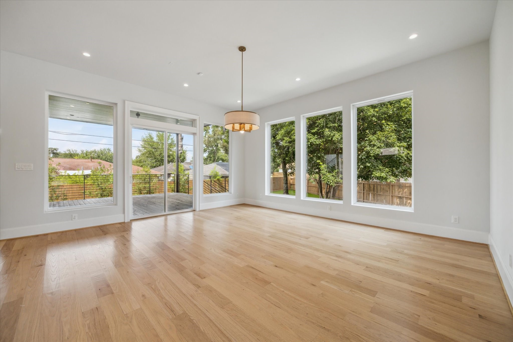 2202 Hewitt Drive Houston, TX 77018 - Photo 15 of 39 Just to the right of the kitchen is the spacious dining room, featuring a sliding door that opens to the large patio—perfect for extending indoor living to outdoor entertaining and unforgettable dinner parties.
