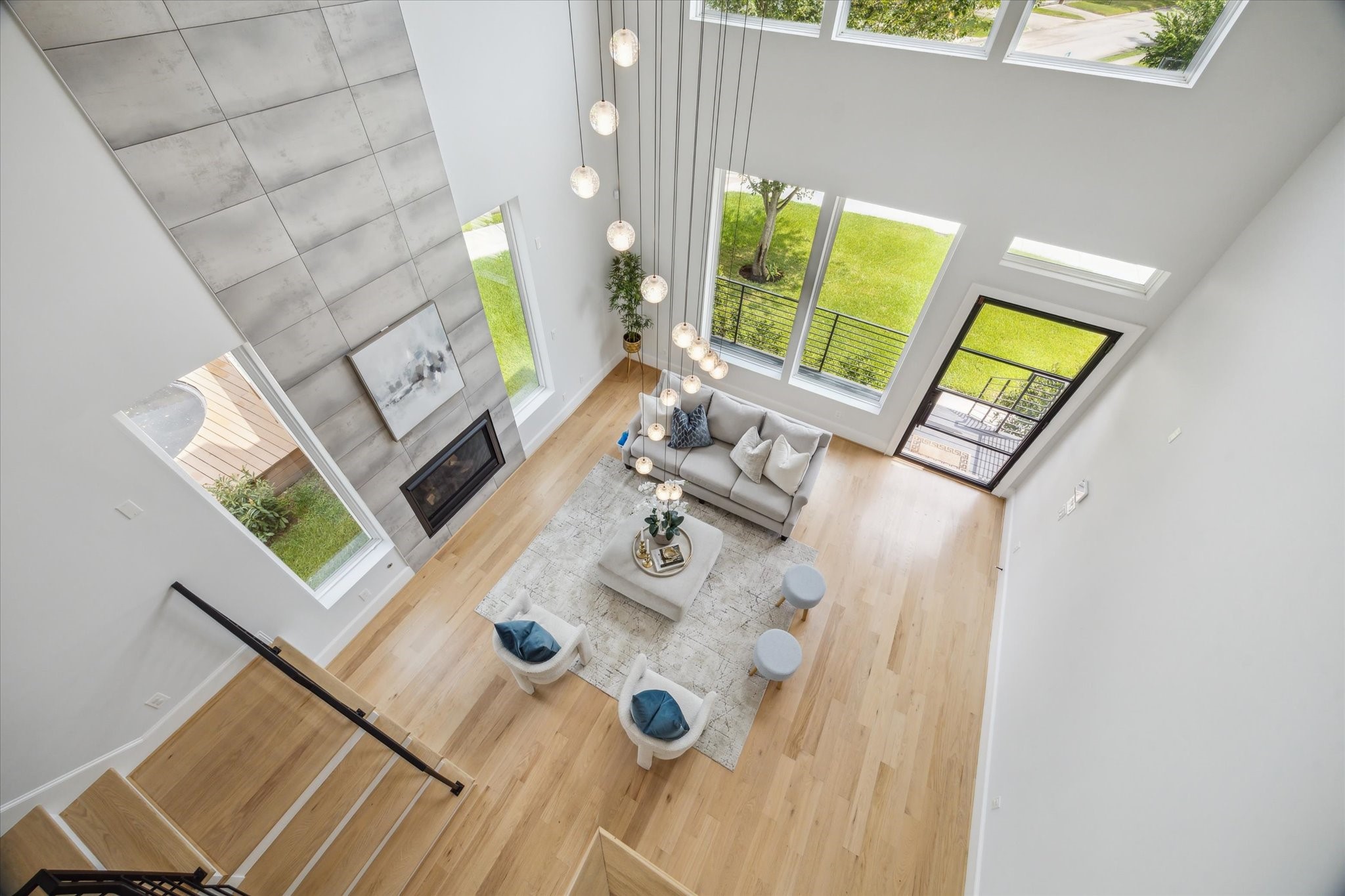 2202 Hewitt Drive Houston, TX 77018 - Photo 20 of 39 Stunning view from the stair landing overlooking the first floor, showcasing the open layout and soaring ceilings.