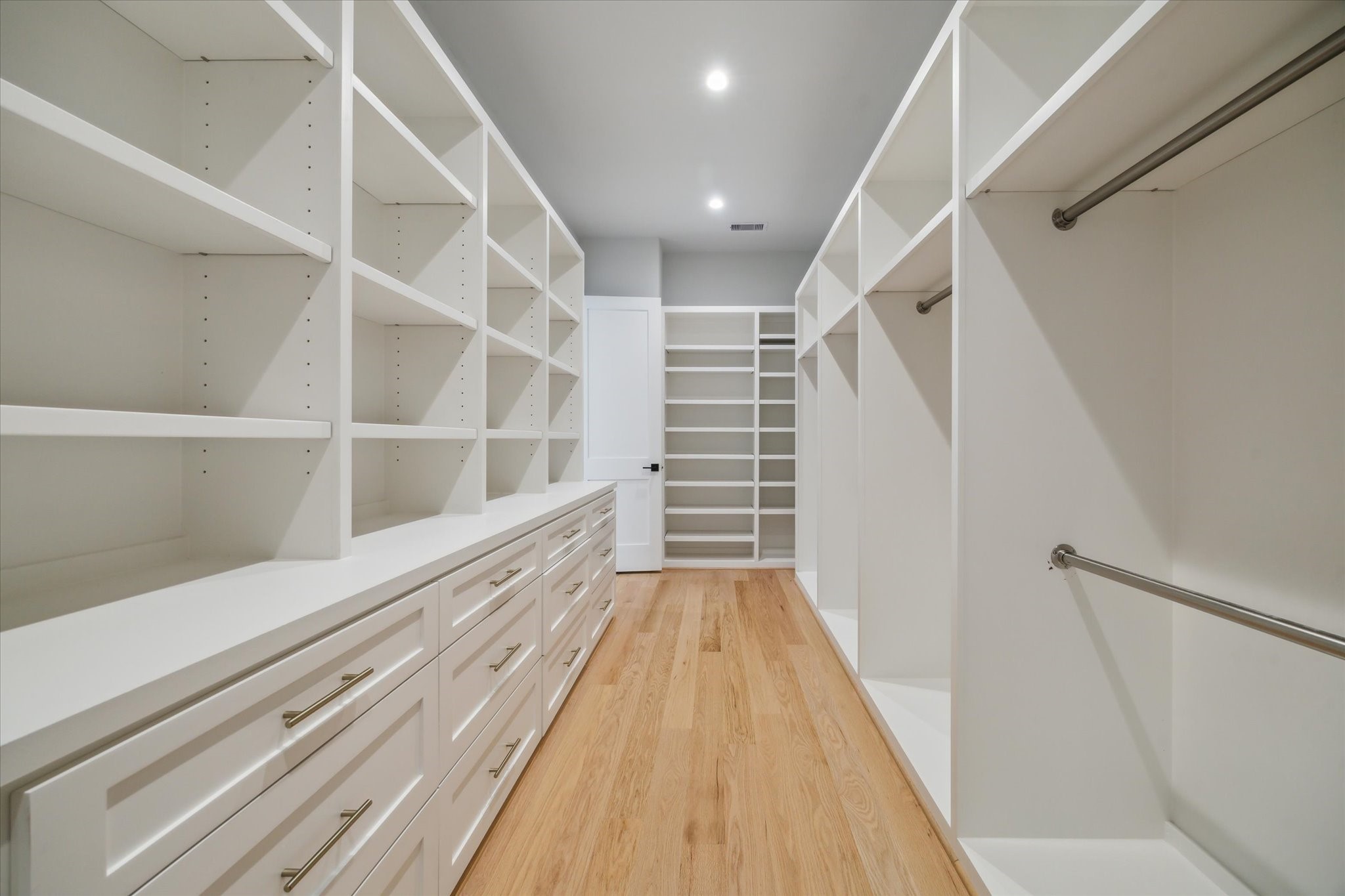 2202 Hewitt Drive Houston, TX 77018 - Photo 25 of 39 Now this is a primary suite closet—thoughtfully designed with custom cabinetry to keep everything organized and beautifully stored.