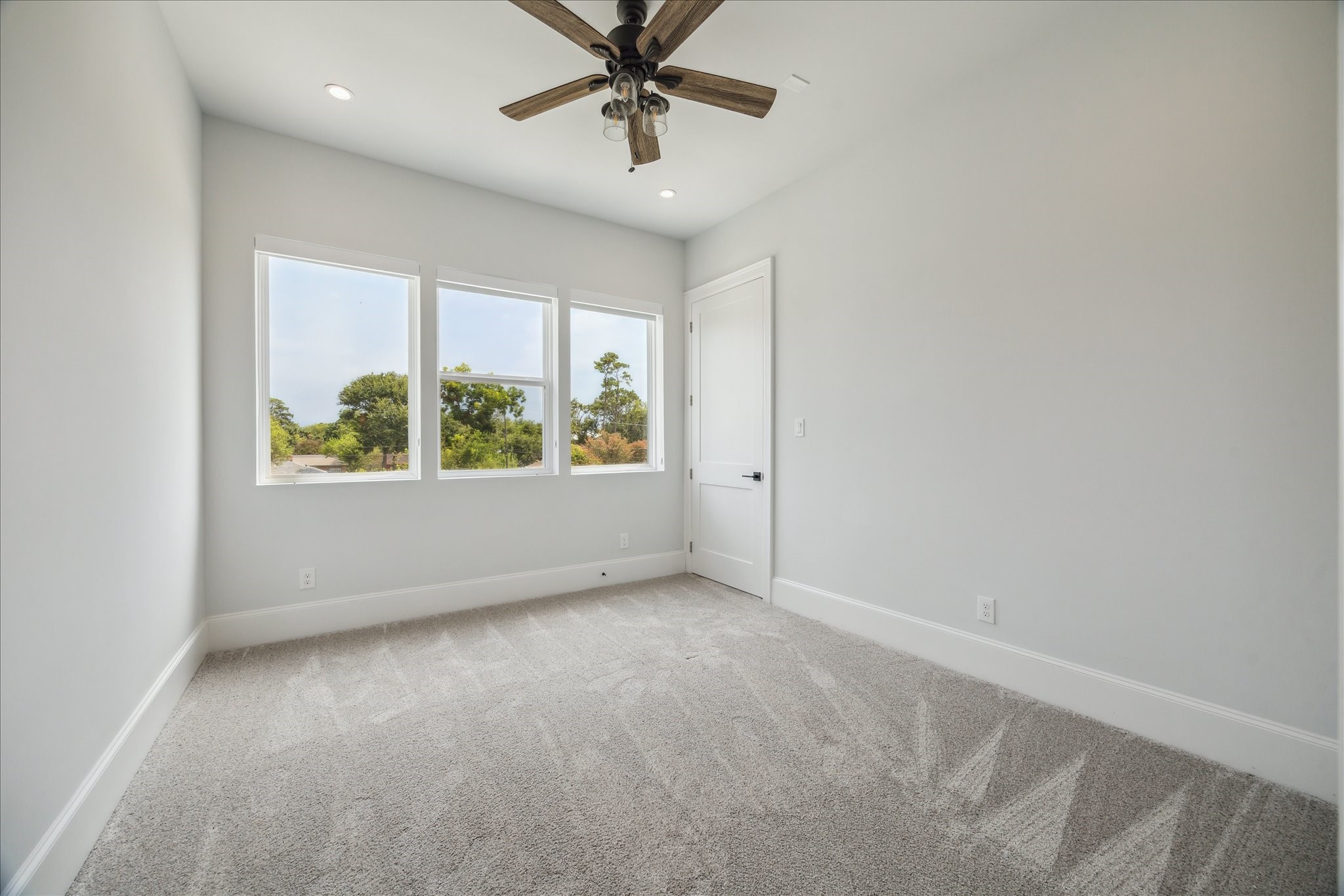 2202 Hewitt Drive Houston, TX 77018 - Photo 28 of 39 One of four secondary bedrooms, this room includes a walk-in closet and shares a hallway bathroom with an adjacent bedroom.