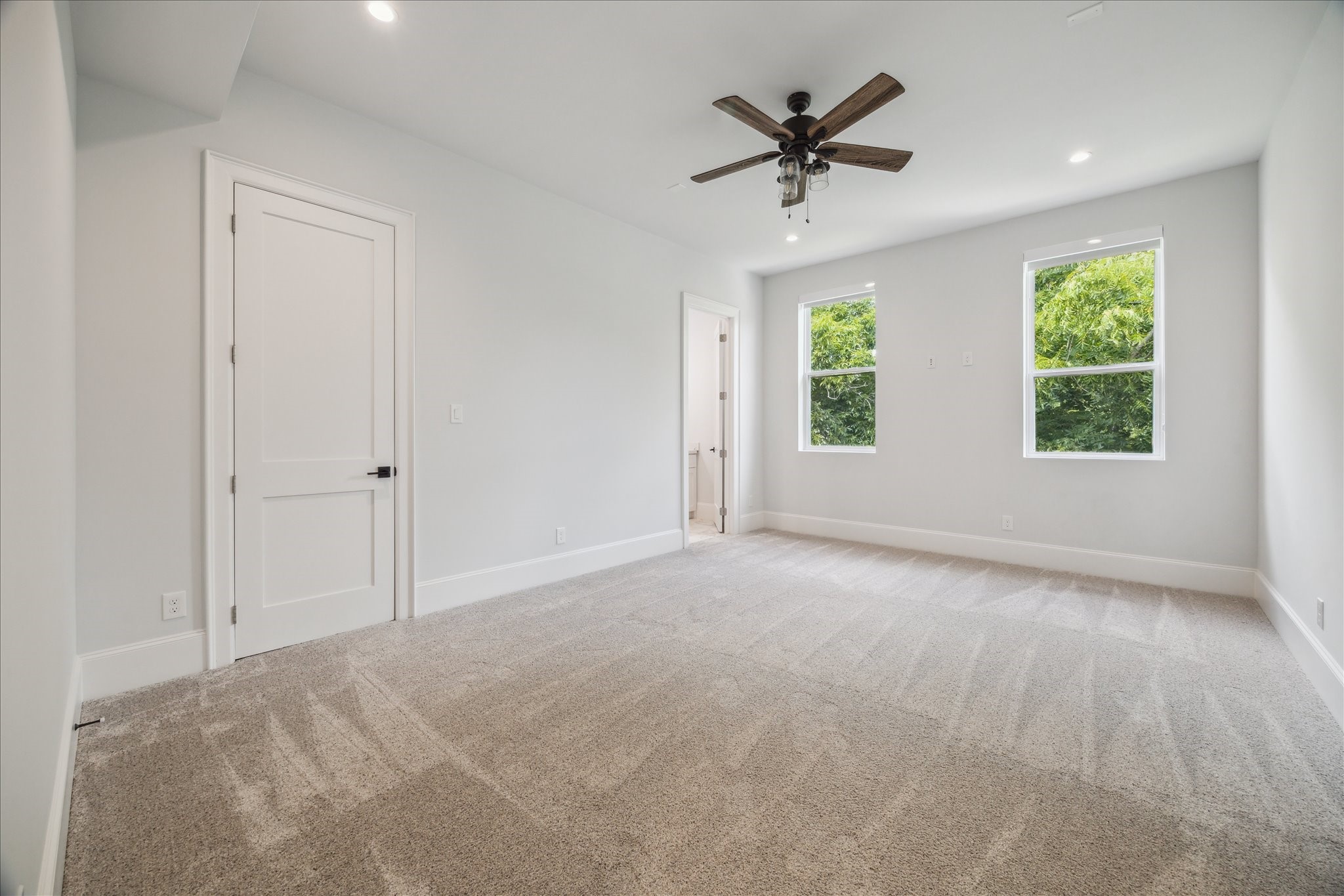 2202 Hewitt Drive Houston, TX 77018 - Photo 33 of 39 The fourth and final secondary bedroom is located near the primary suite and features a spacious walk-in closet and ensuite bathroom.