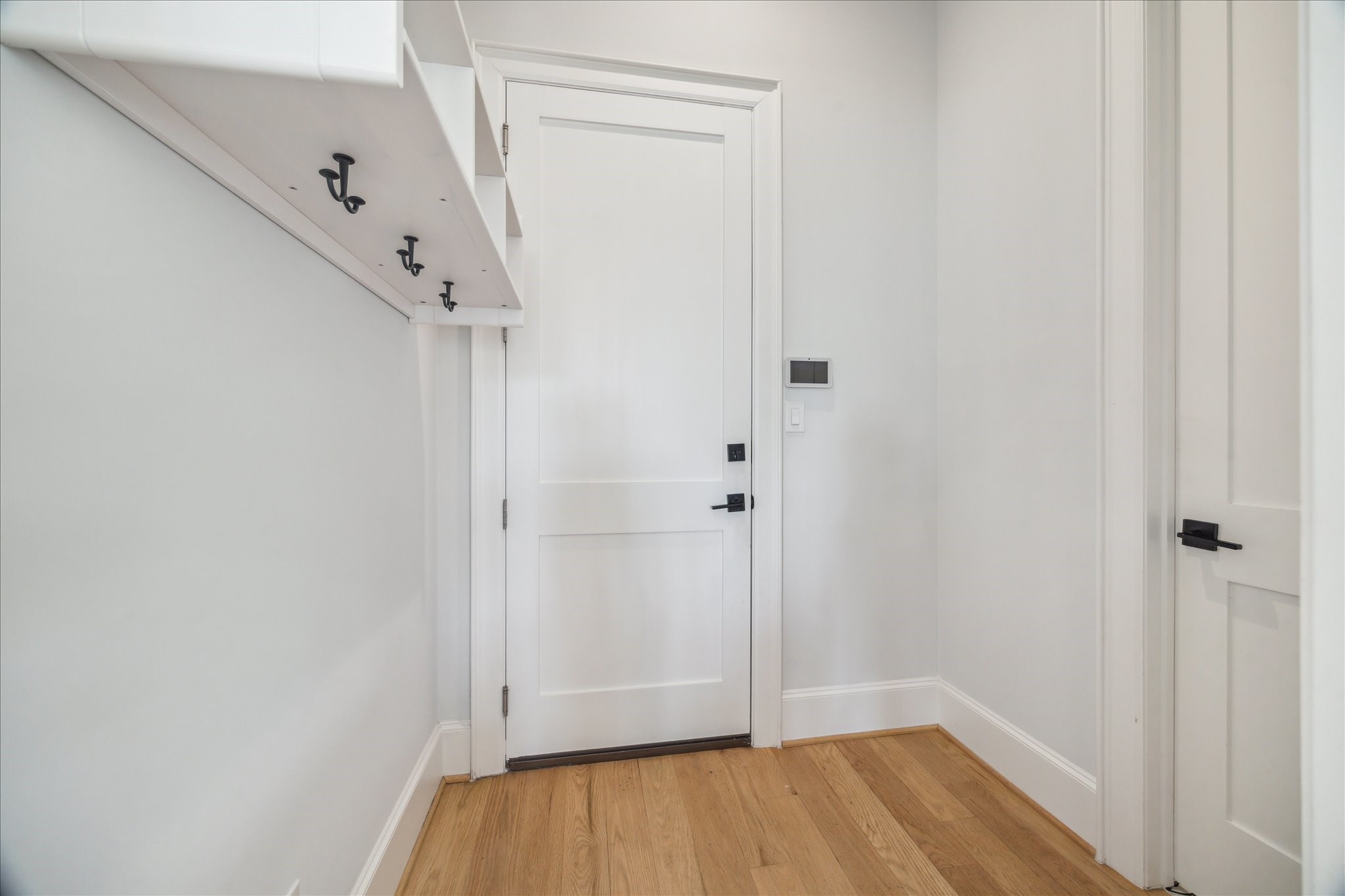 2202 Hewitt Drive Houston, TX 77018 - Photo 35 of 39 Off the attached two-car garage is the mudroom/garage entrance, with a door to the left leading to the powder bath. This area is conveniently located just off the kitchen.