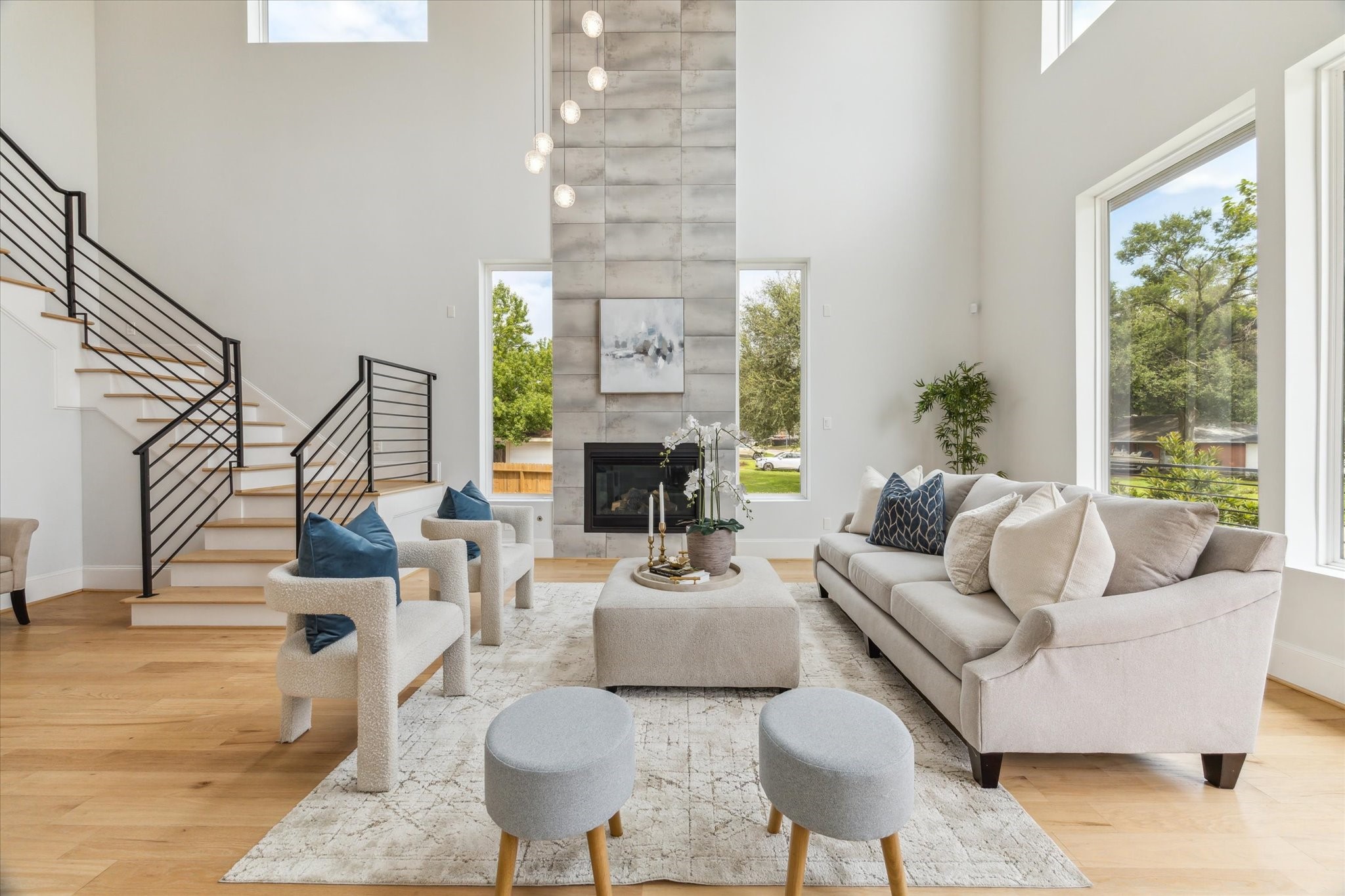 2202 Hewitt Drive Houston, TX 77018 - Photo 8 of 39 This formal living room is tucked away from the kitchen and dining areas, ideal for entertaining guests. It features a two-story tile surround gas log fireplace and a modern drop ceiling design.