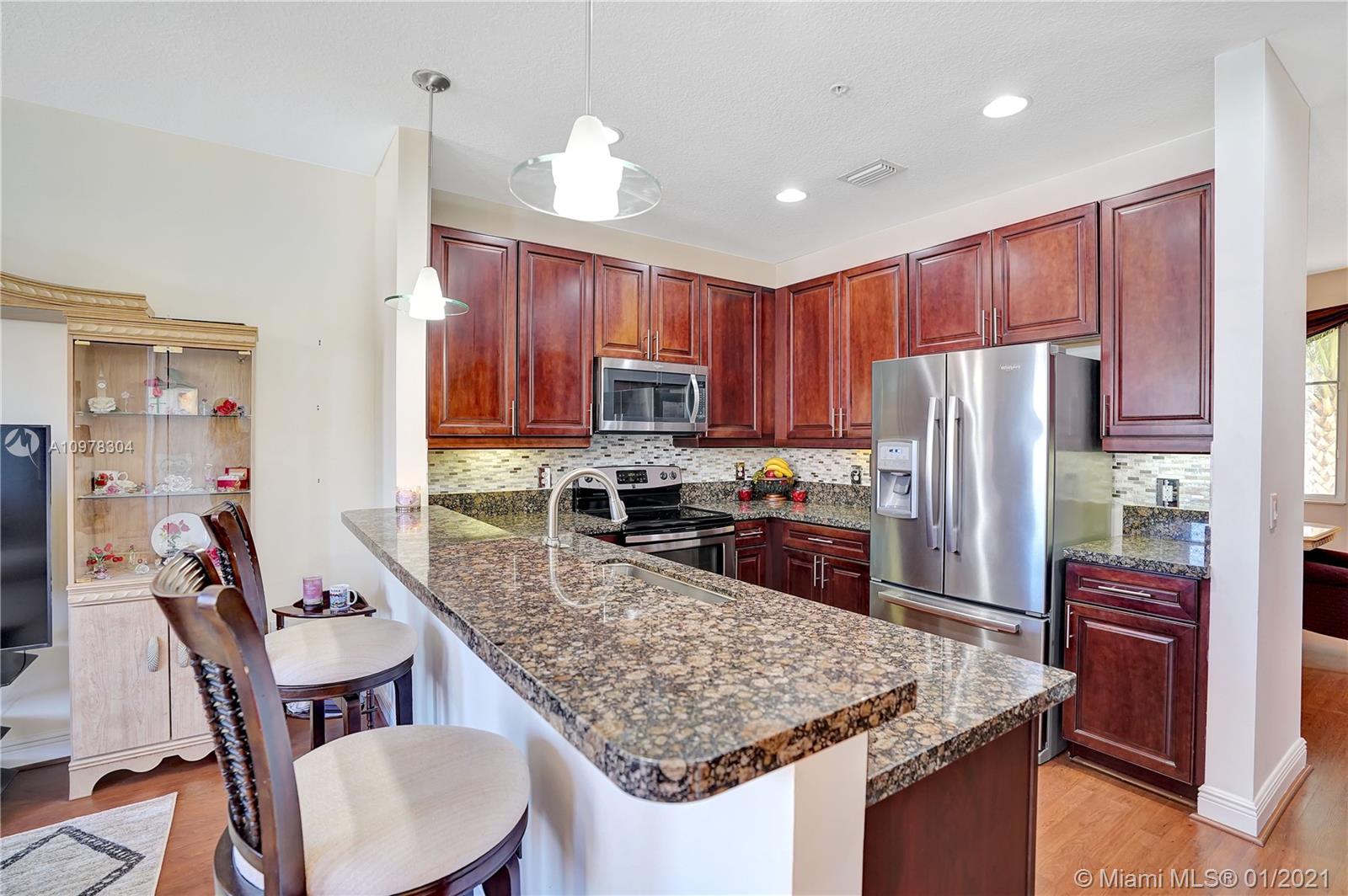 535 Northwest 35th Place Boca Raton, FL 33431 - Photo 16 of 52 KICHEN - LOOKING FROM LIVING ROOM