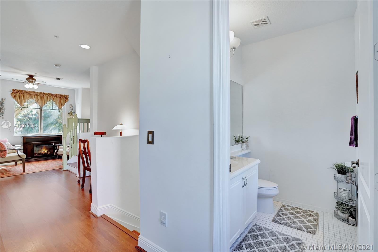 535 Northwest 35th Place Boca Raton, FL 33431 - Photo 20 of 52 HALF BATHROOM AND HALL WAY TO THE DINNING ROOM