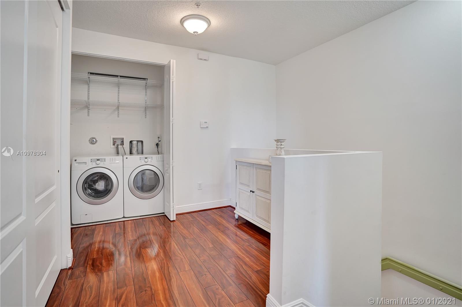 535 Northwest 35th Place Boca Raton, FL 33431 - Photo 31 of 52 LAUNDRY ROOM AND LOFT AREA 3RD FLOOR