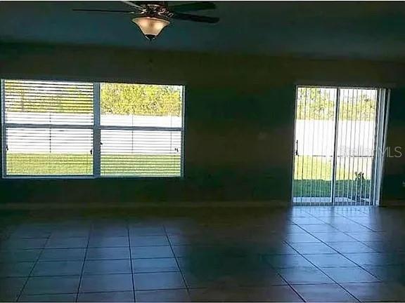 1606 Redmond Brook Lane Ruskin, FL 33570 - Photo 12 of 26 a living room with a window